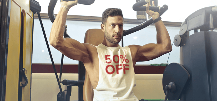 personal-trainer-wearing-a-shirt-that-says-fifty-percent-off