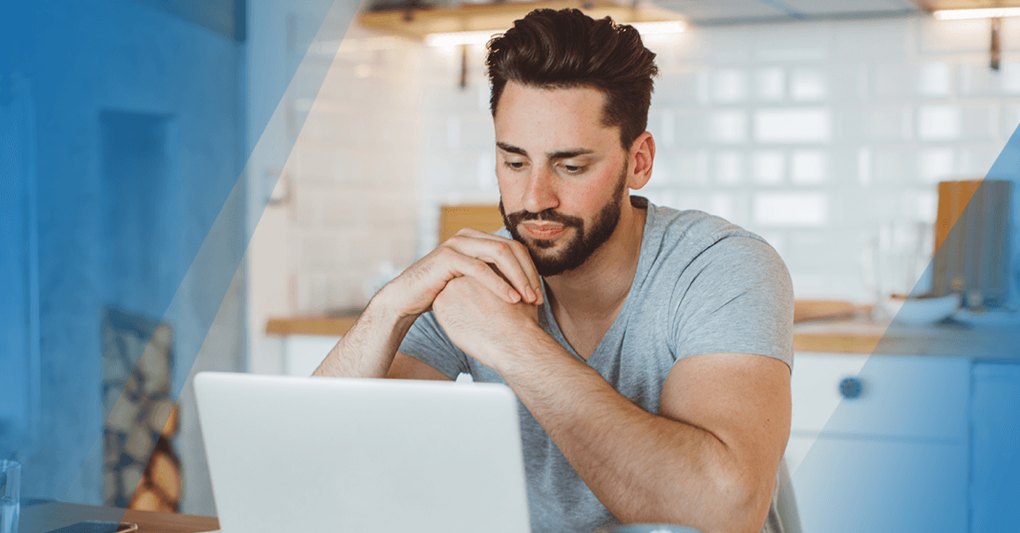 gym-owner-looking-at-laptop-at-home